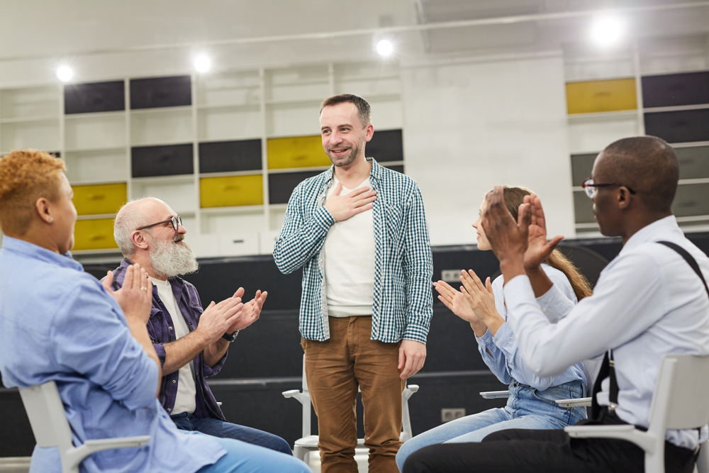 man introducing himself group therapy