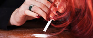 woman snorting narcotics