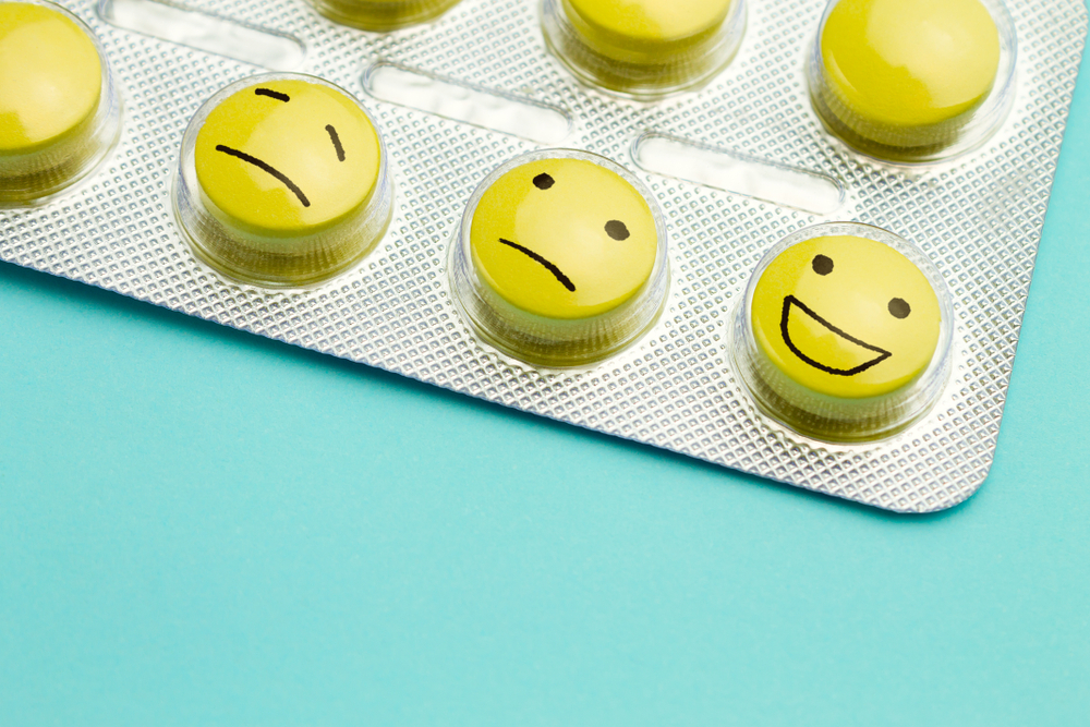 blister pack of pills with happy faces